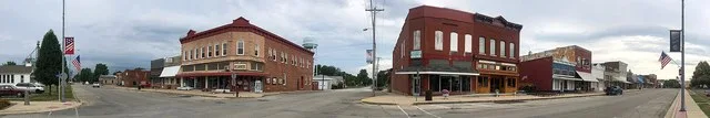 A panorama of buildings along Locust Street in the small town of Chatsworth, Illinois . The center of the photo looks north along Fourth Street.