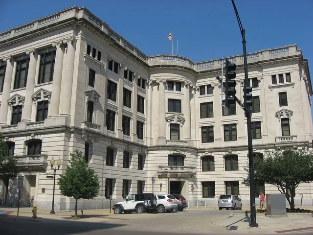 Front of the Vermilion County Courthouse , located on the northeastern corner of the junction of Main ( U.S. Route 136 ) and Vermilion Streets in downtown Danville , Illinois , Un...