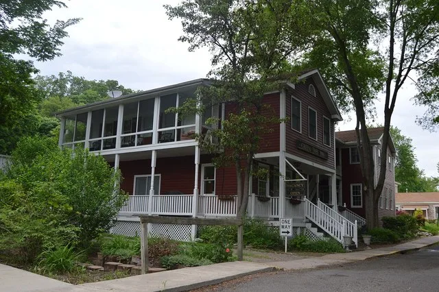 Front of the house on the northwestern corner of the junction of Mill and Selma Streets in Elsah , Illinois , United States . This house and the surrounding blocks are part of the...