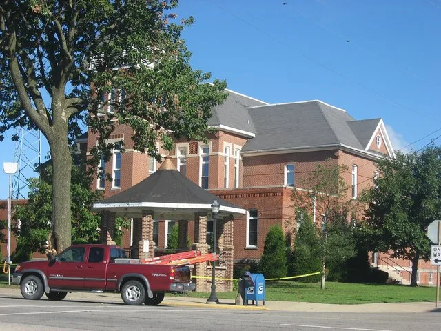 Front and eastern side of the Wayne County Courthouse , located at 301 E. Main Street ( Illinois Route 15 ) in downtown Fairfield , Illinois , United States . It was built in 1891.