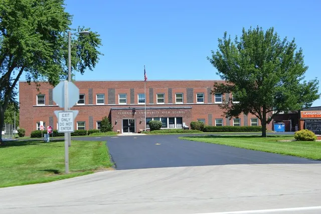 Front of the older section of the high school on Illinois Route 116 in Flanagan , Illinois , United States .