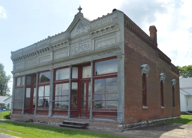 Front and northern side of the Exchange Bank , located on Quincy Street in Golden , Illinois , United States . Built in 1891, it is listed on the National Register of Historic Pla...