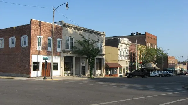 Buildings on the eastern side of the 100 block of N. Second Street (the eastern side of the courthouse square) in Greenville , Illinois , United States .