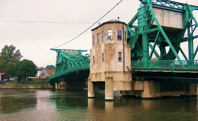 The Jackson Street Bridge, in Joliet, Illinois, is a 1933-built bascule drawbridge of the Scherzer Rolling Lift type. It crosses the Des Plaines River. This view is from the south...