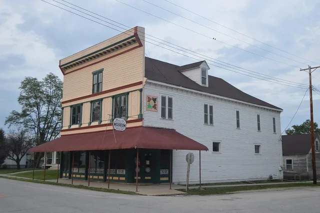 Front and southern side of the Kamp Store , located on the northeastern corner of the junction of Broadway ( Illinois Route 100 ) and Oak Street in Kampsville , Illinois , United...