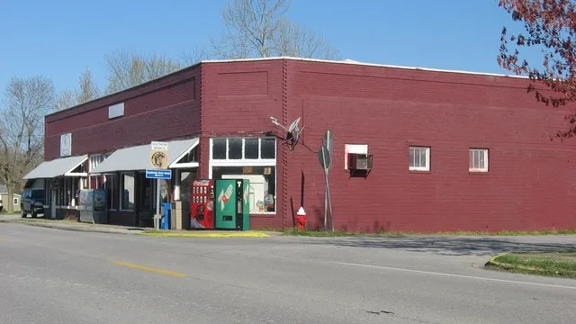 A commercial building on the northwestern corner of the junction of Washington ( Illinois Route 169 ) and First Streets in downtown Karnak , Illinois , United States .