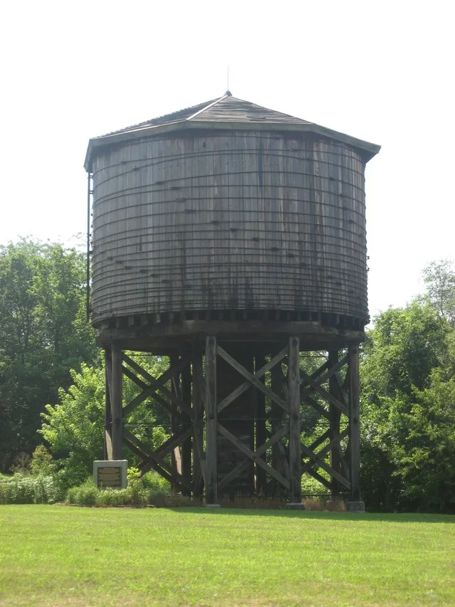 Roadside view of the Illinois Central Railroad Water Tower , located on the southern side of Illinois Route 37 immediately southwest of Kinmundy in Kinmundy Township , Marion Coun...