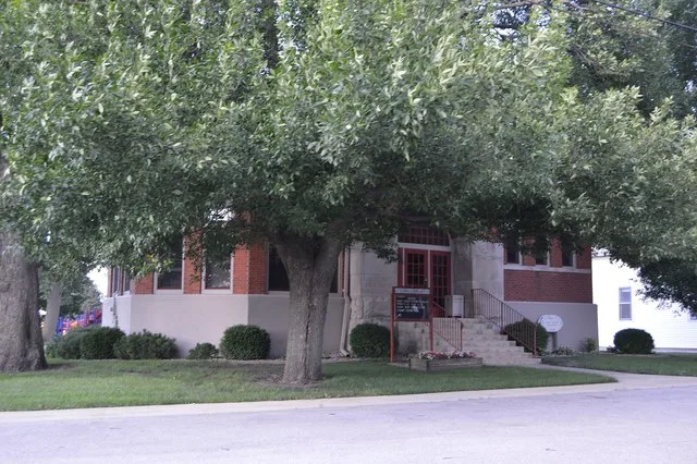 Front and western side of the A. Herr and E.E. Smith Public Library , located at 105 S. First Street in Loda , Illinois , United States . Built in 1897, it is listed on the Nation...