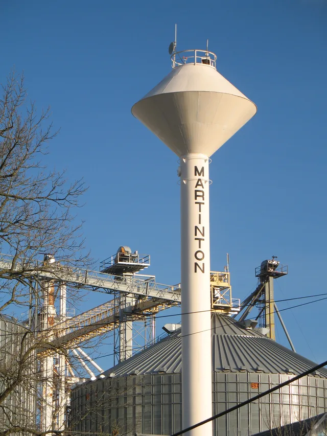 Water tower in Martinton, Illinois with grain elevator in the background