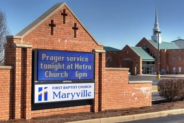Entrance sign and front of Maryville First Baptist Church, Maryville, Illinois . The prayer service was scheduled for Senior Pastor Fred Winters, who was shot and killed that morn...