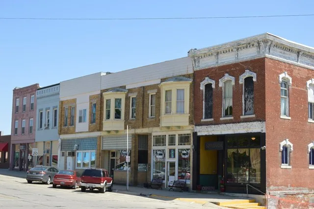 Buildings on the southern side of Cooke Street on the courthouse square in Mount Pulaski , Illinois , United States .