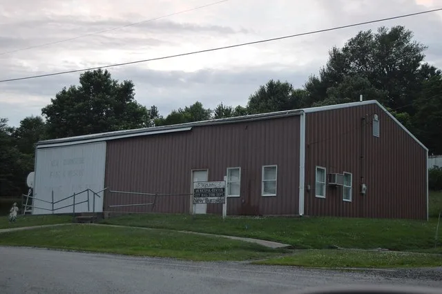 Southeastern and northern sides of the New Burnside municipal building, located at the intersection of Second and Vine Streets in New Burnside , Illinois , United States .