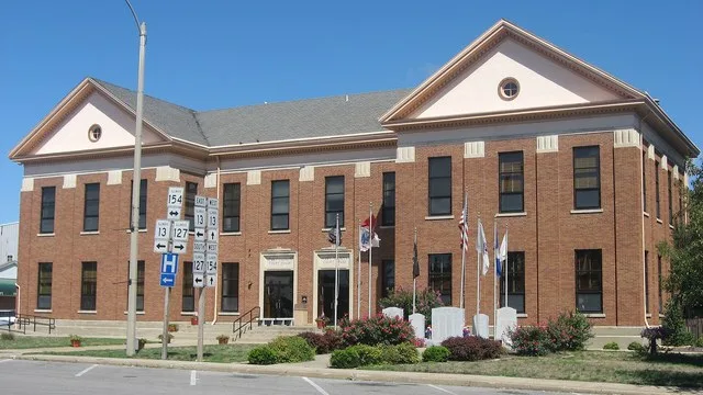 Front and eastern side of the Perry County Courthouse , located along Illinois Routes 13 , 127 , and 154 on Courthouse Square in Pinckneyville , Illinois , United States . It was...