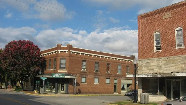 Buildings on the northern corners of the junction of Franklin Street ( Illinois Route 154 ) and Broadway in downtown Sesser , Illinois , United States .
