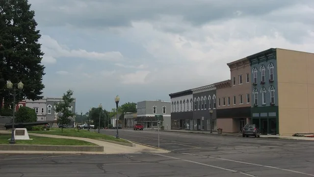 Buildings on Jefferson Street on the southern side of Courthouse Square in Sullivan , Illinois , United States .
