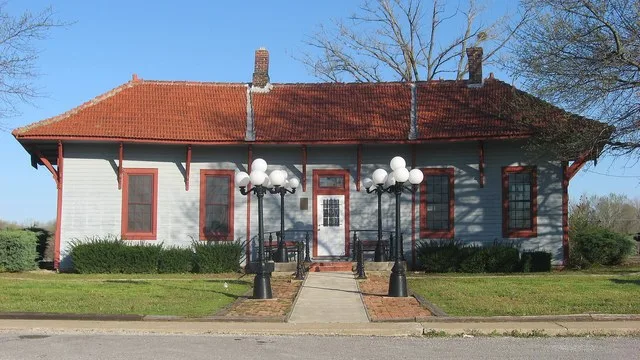 Front of the former Tamms Depot (now Village Hall), located on Front Street north of Russell Avenue in Tamms , Illinois , United States . Built in 1900, it is listed on the Nation...