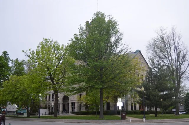 View from the southeast of the Christian County Courthouse , located on Courthouse Square in Taylorville , Illinois , United States . Built in 1902, it is part of the Taylorville...