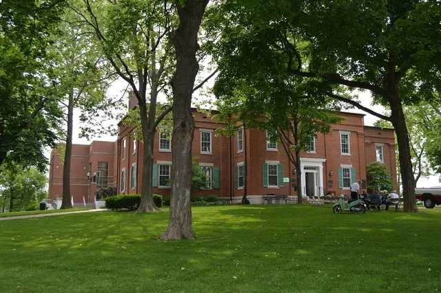 Western front of the Monroe County Courthouse , located on Courthouse Square in central Waterloo , Illinois , United States . Built in 1851 and repeatedly expanded, it is part of...