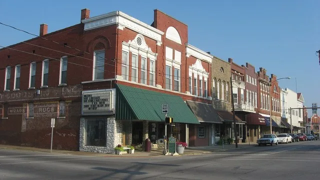 Buildings on Third Street facing Courthouse Square in Boonville , Indiana , United States . This block is part of the Boonville Public Square Historic District , a historic distri...