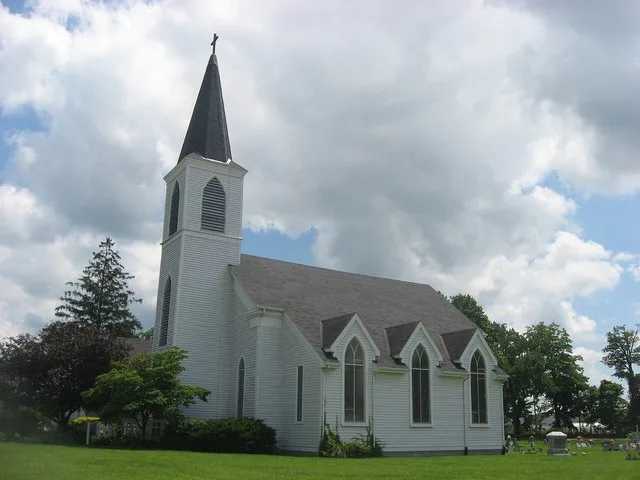 Western side of St. John of the Cross Episcopal Church , located at 601 E. Vistula Street ( State Road 120 ) in Bristol , Indiana , United States . Built in 1830, it is listed on...