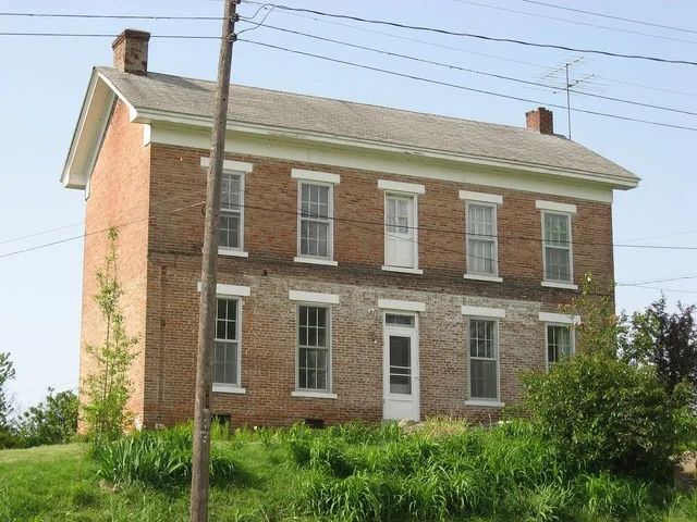 Front of the Alfred Simonson House , located at 207 E. Shipping Street in Edwardsport , Indiana , United States . Built in 1873, it is listed on the National Register of Historic...