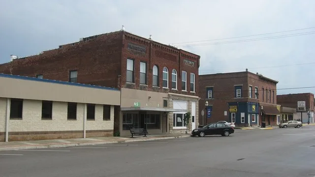 Buildings on the eastern sides of the 200 and 300 blocks of S. Newton Street in Goodland , Indiana , United States . The nearest brick building is the Humston and Butler Building...