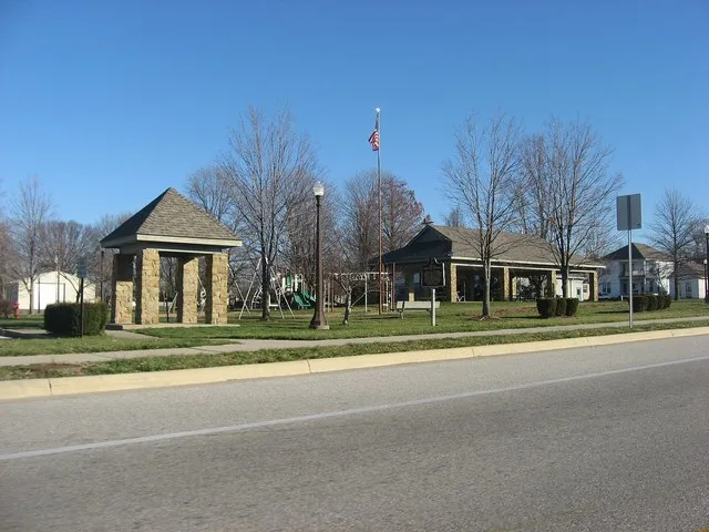 Southwestern corner of the town square in Hartsville , Indiana , United States , seen from State Road 46 . The historical marker commemorates Hartsville native Corporal Barton W...