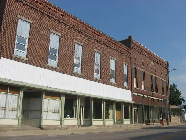 Buildings at 412 (left) and 416 (right) N. Main Street ( U.S. Route 421 ) in Monon , Indiana , United States . Built in 1899, they are part of the Monon Commercial Historic Distri...