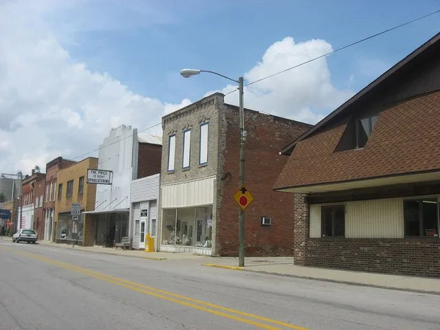 Buildings on the northern side of the 100 block of E. South Street ( State Road 101 ) in Monroeville , Indiana , United States .