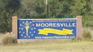 Welcome sign at Mooresville, Indiana, recognizing the town as the "Home of the Indiana State Flag."