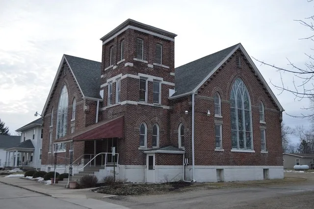 Front and western side of the Poneto United Methodist Church, located at 36 E. Walnut Street in Poneto , Indiana , United States .