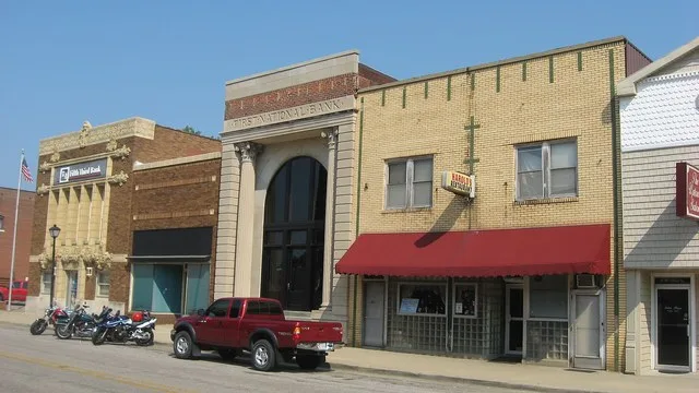 Buildings on the northern side of the first block of W. Main Street (State Roads 68 / 165 ) in downtown Poseyville , Indiana , United States . From right to left, they were built...