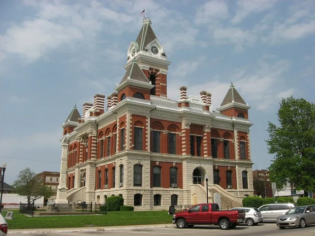 Southern front and western side of the Gibson County Courthouse , located along State Roads 64 and 65 on Courthouse Square in downtown Princeton , Indiana , United States . Built...