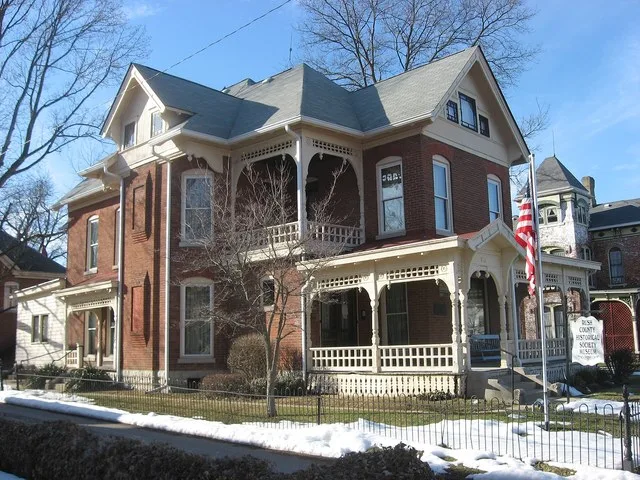 Front and southern side of the John K. Gowdy House , located at 619 N. Perkins Street in Rushville , Indiana , United States . Built in 1888 and now the home of the Rush County Hi...