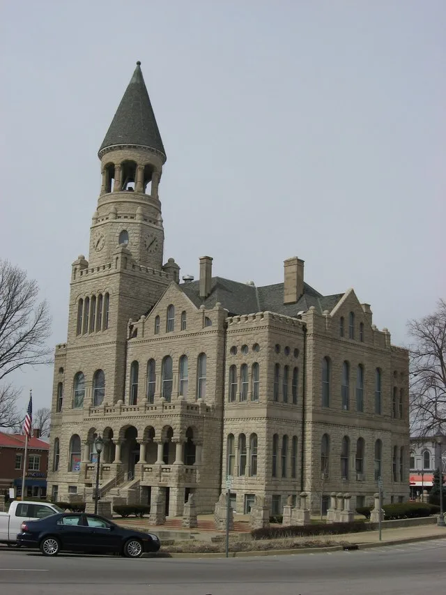 Front and eastern side of the Washington County Courthouse , located at the center of the public square in Salem , Indiana , United States . Built in 1886, it is listed on the Nat...