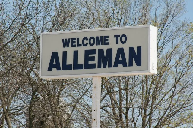 Welcome sign for Alleman, Iowa