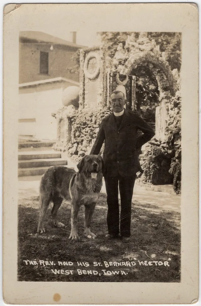 The Rev. and his St. Bernard Hector, West Bend, Iowa.