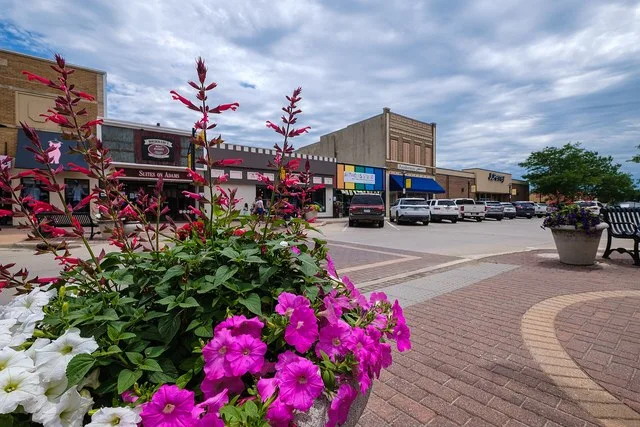 A planter with flowers in downtown Carroll, IA.