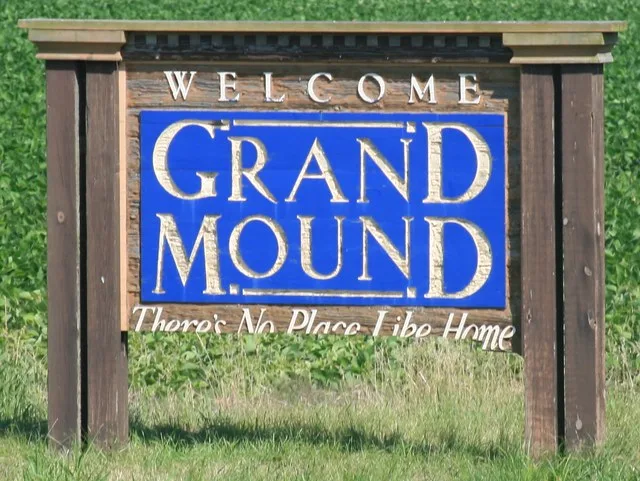 Welcome sign for Grand Mound, Iowa