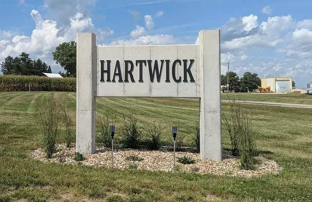 Welcome sign for Hartwick, Iowa