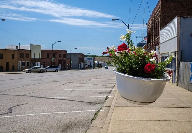 Looking down Main Street with a flower planter in view.