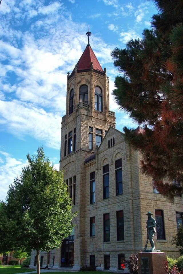 Front of the Iowa County Courthouse , located on Main Avenue in downtown Marengo , Iowa , United States . Built in 1892, the courthouse is listed on the National Register of Histo...