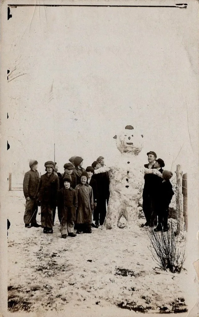 Postcard of a snowman in Newhall, Iowa, 1918
