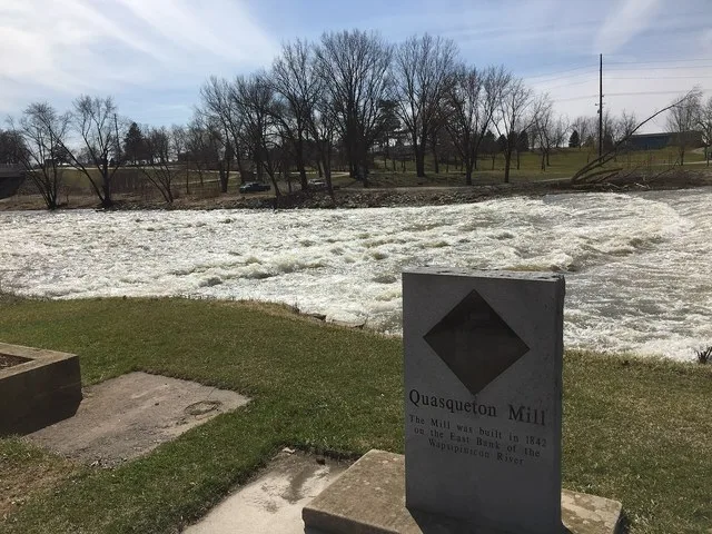 Rapids on Wapsipinicon River with old mill monument at Quasqueton, Iowa