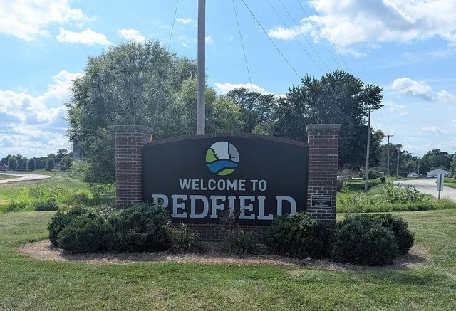 The welcome sign at the edge of Redfield, Iowa
