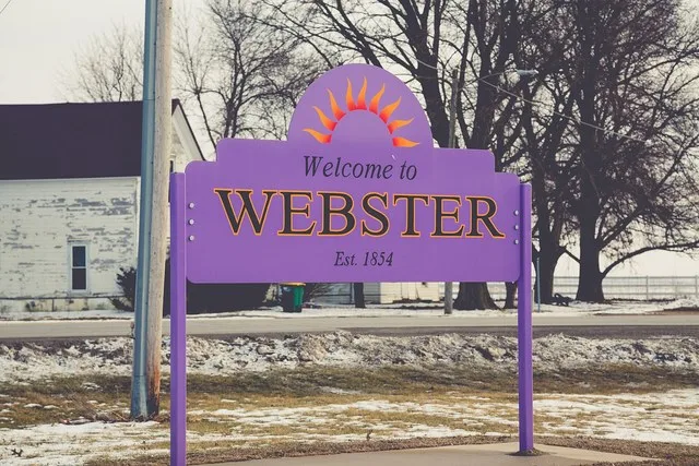 A welcome sign along Iowa Highway 149 in the small rural farming town of Webster, Iowa.