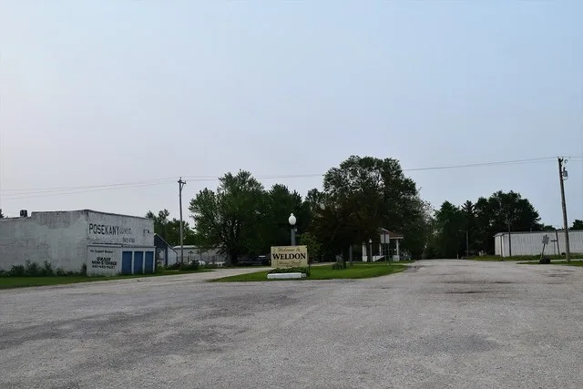 The welcome sign for Weldon, Iowa .