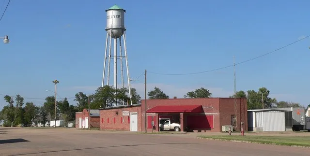 Downtown Collyer, Kansas: west side of Ainslie Avenue north of 3rd Street. Camera is facing northeast from between 3rd and 4th.