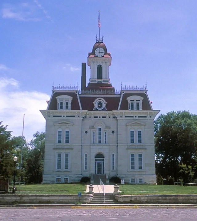 Front of the Chase County Courthouse in Cottonwood Falls , Kansas , United States . Built in 1873, it is listed on the National Register of Historic Places .