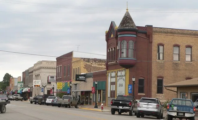 Downtown Ellsworth, Kansas: east side of Douglas. The building with the turret left of center is the Insurance Building, at 115 N. Douglas. The gray stone building right of center...